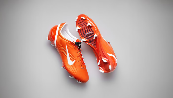 Chuteira Nike Mercurial Vapor 1 Elite FG Shock Orange e branca, edição limitada inspirada em Cristiano Ronaldo, com cabedal FlyTouch+ e solado Air Zoom.
